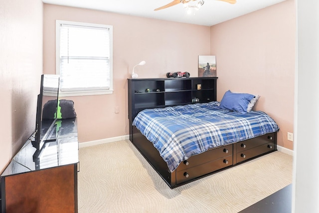 bedroom featuring ceiling fan, carpet, and baseboards