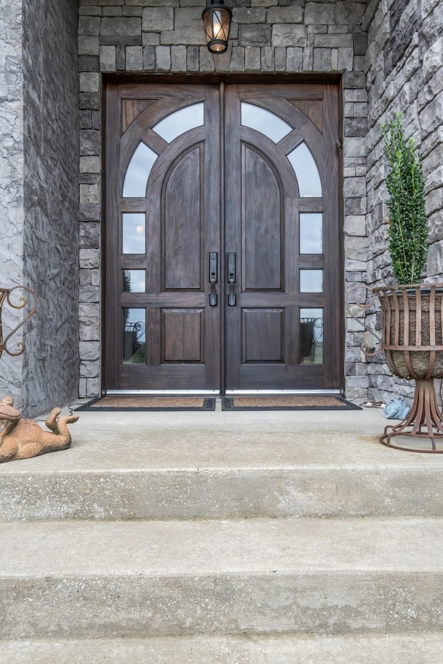 view of exterior entry with stone siding