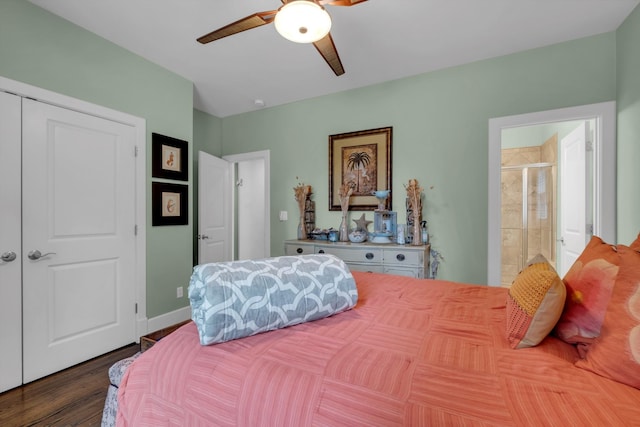 bedroom with baseboards, a ceiling fan, dark wood-type flooring, and ensuite bathroom