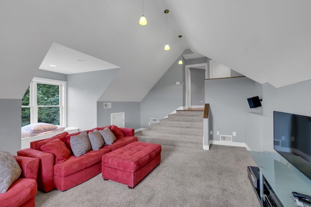 carpeted living room with stairs, lofted ceiling, visible vents, and baseboards