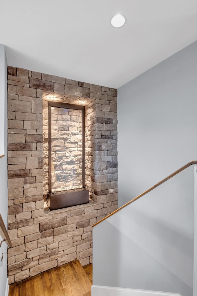 stairway with wood finished floors