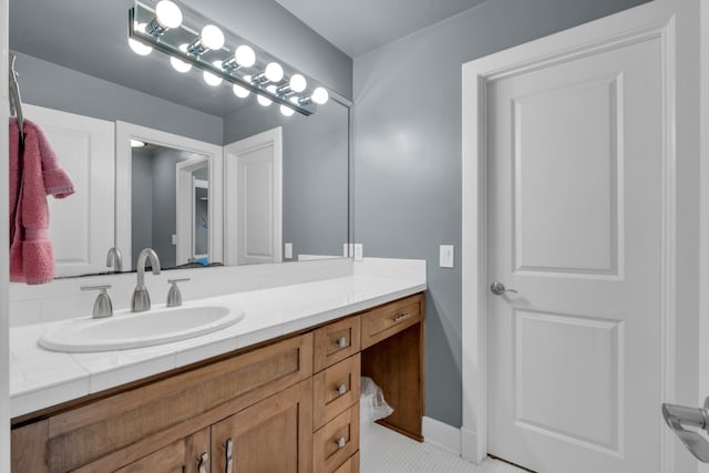 bathroom featuring baseboards and vanity