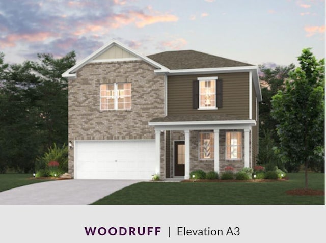 view of front of home with an attached garage, a front lawn, concrete driveway, and brick siding