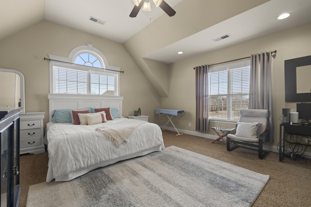 bedroom with vaulted ceiling, carpet floors, visible vents, and baseboards