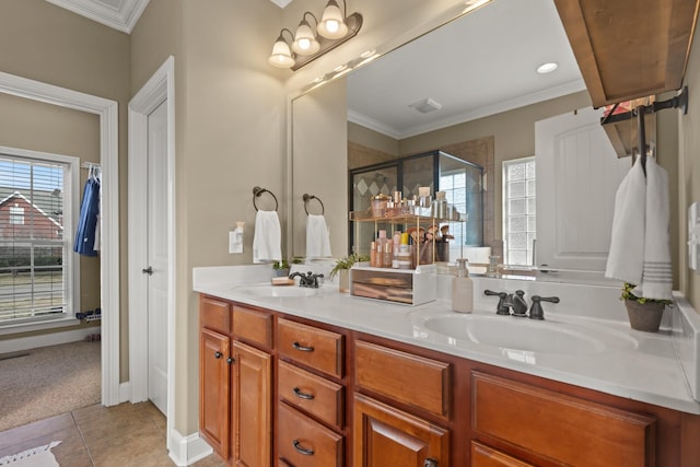 full bath with plenty of natural light, a sink, and double vanity