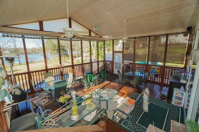 sunroom / solarium with vaulted ceiling, ceiling fan, a water view, and wooden ceiling