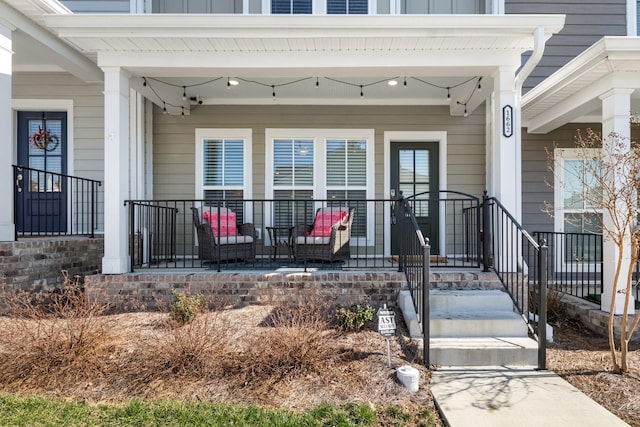 property entrance with a porch and board and batten siding