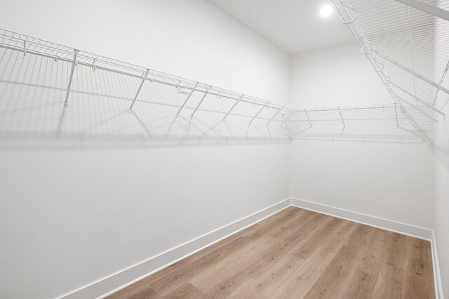 walk in closet featuring light wood-style floors