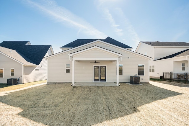 rear view of house featuring ceiling fan, a patio, central AC unit, and fence