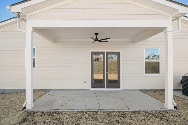 exterior space with french doors, a ceiling fan, and a patio