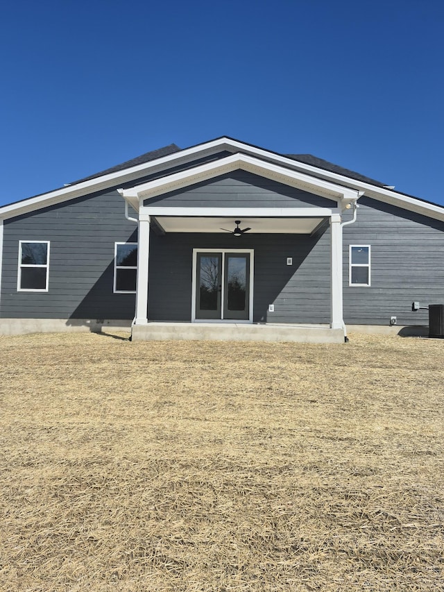 back of house featuring ceiling fan and cooling unit