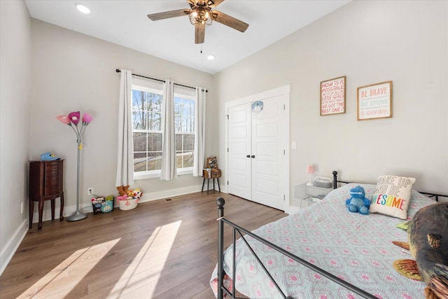 bedroom with a ceiling fan, recessed lighting, baseboards, and wood finished floors