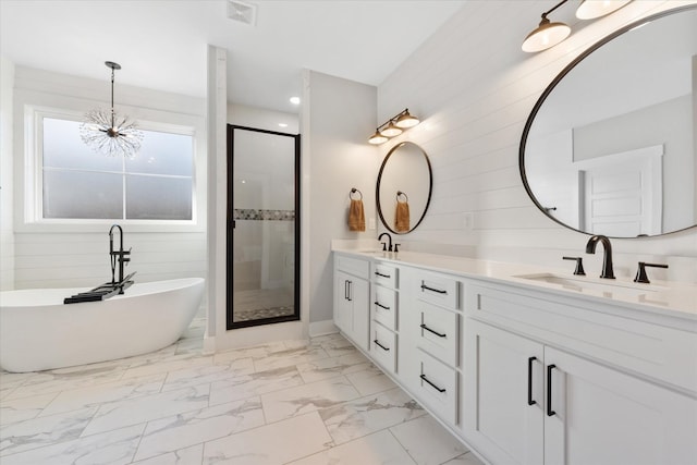 full bath with marble finish floor, double vanity, visible vents, a sink, and a shower stall