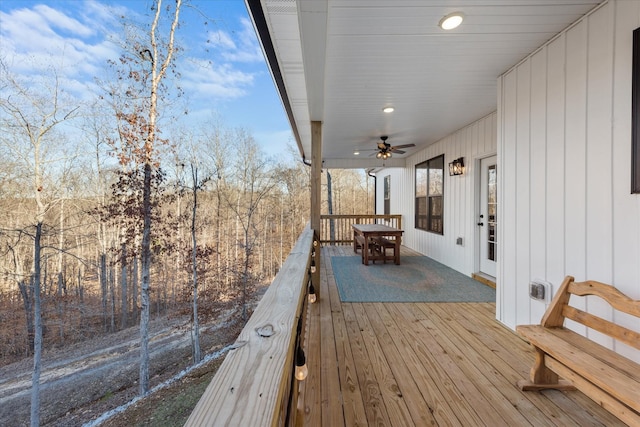 wooden deck featuring a ceiling fan