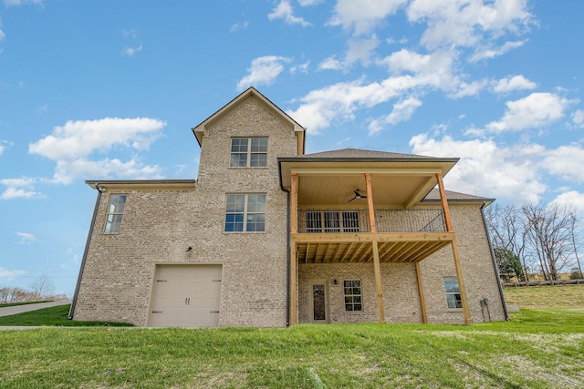 back of house with a balcony, brick siding, a ceiling fan, and a yard