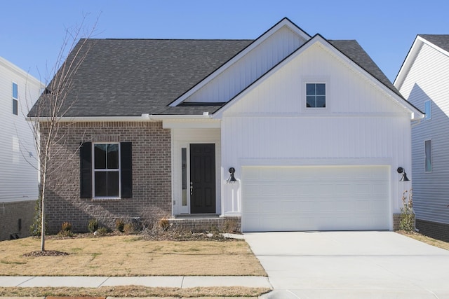 view of front of property featuring concrete driveway, brick siding, roof with shingles, and an attached garage