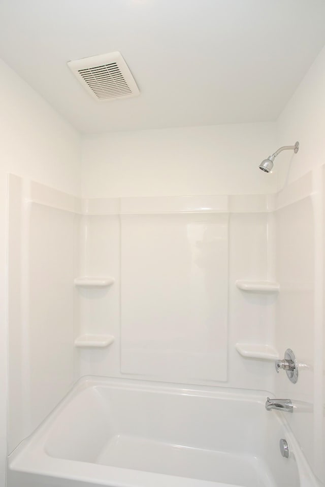 bathroom with shower / bath combination and visible vents