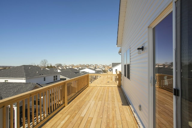 wooden deck featuring a residential view