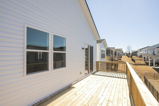 wooden deck featuring a residential view