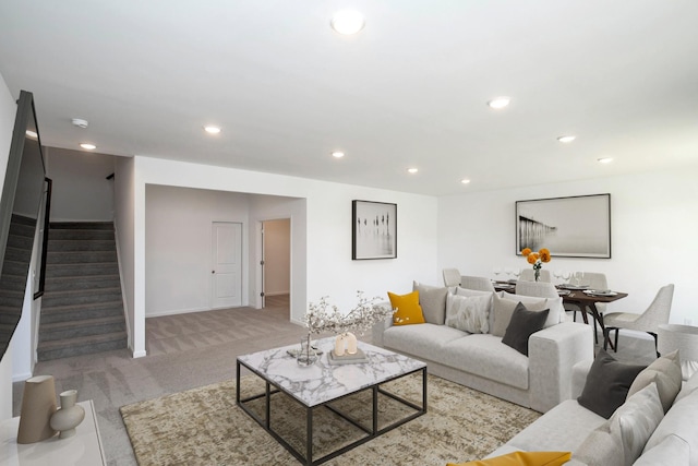 living room featuring carpet floors, stairway, and recessed lighting