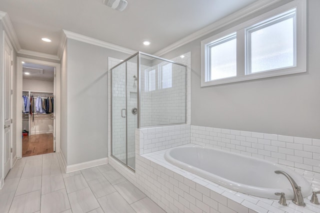 bathroom with crown molding, visible vents, a spacious closet, a stall shower, and a bath