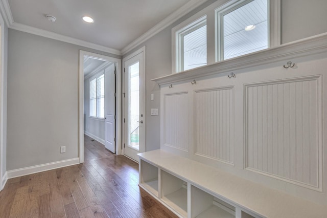 mudroom featuring ornamental molding, baseboards, and wood finished floors