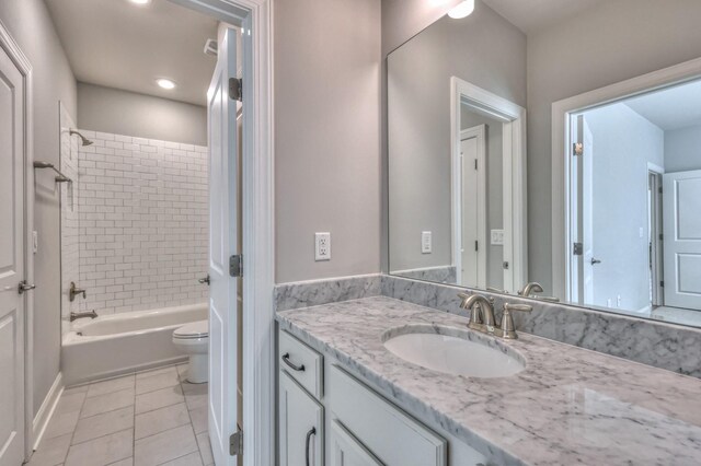 full bathroom featuring shower / washtub combination, tile patterned flooring, vanity, and toilet