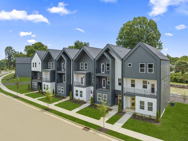 view of property with a residential view and a front yard