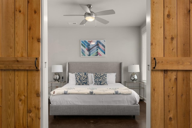 bedroom with visible vents and a ceiling fan