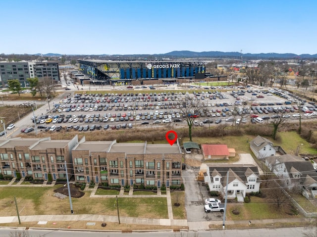 drone / aerial view with a view of city and a mountain view