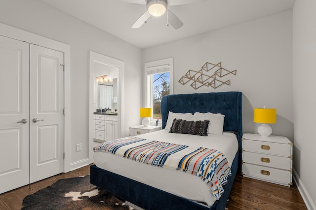 bedroom featuring connected bathroom, baseboards, and dark wood-style flooring