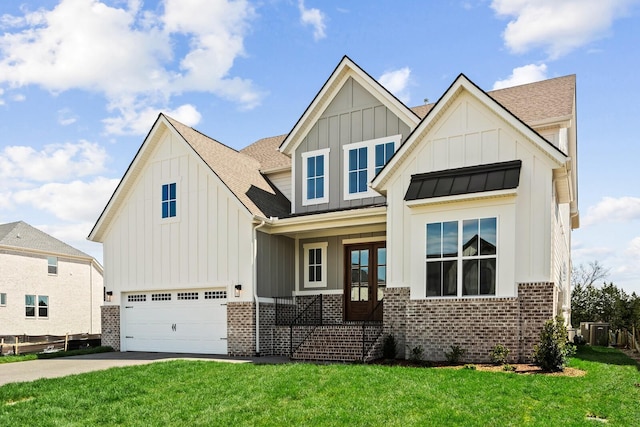 view of front of property featuring driveway, a garage, a front lawn, board and batten siding, and brick siding