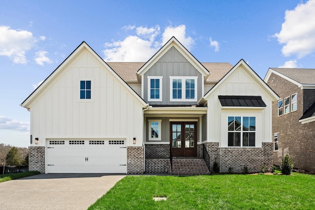 view of front of house featuring french doors, brick siding, an attached garage, board and batten siding, and a standing seam roof