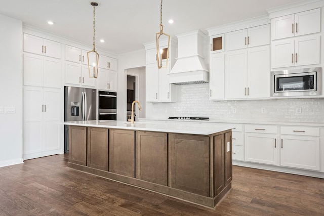 kitchen featuring light countertops, custom range hood, black appliances, and white cabinetry