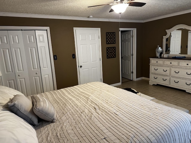 bedroom with a textured ceiling, light tile patterned floors, a ceiling fan, a closet, and crown molding