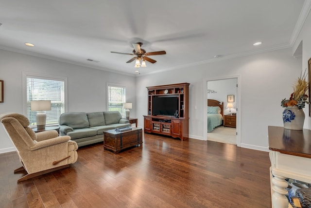 living area featuring visible vents, ornamental molding, a ceiling fan, recessed lighting, and dark wood-type flooring