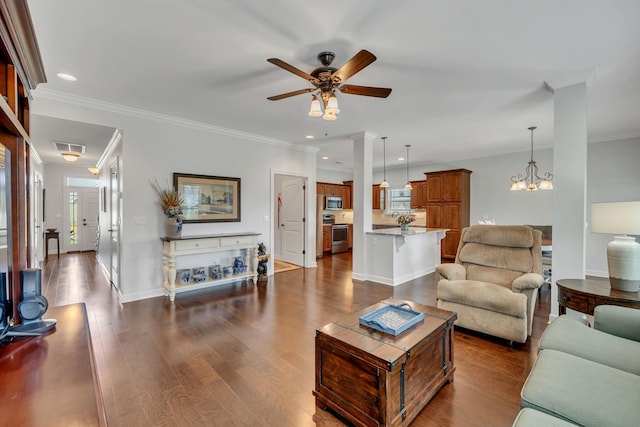 living area with dark wood-style flooring, visible vents, and ceiling fan with notable chandelier