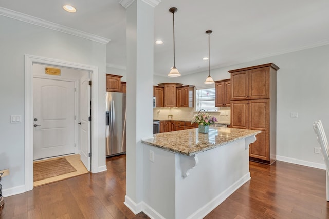 kitchen featuring stainless steel fridge with ice dispenser, dark wood-type flooring, crown molding, and brown cabinets