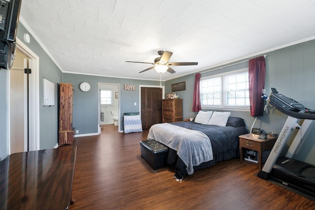 bedroom featuring multiple windows, ornamental molding, and dark wood-style flooring