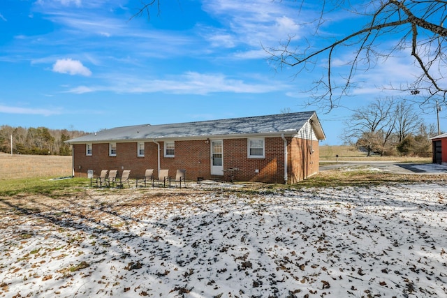 exterior space featuring brick siding