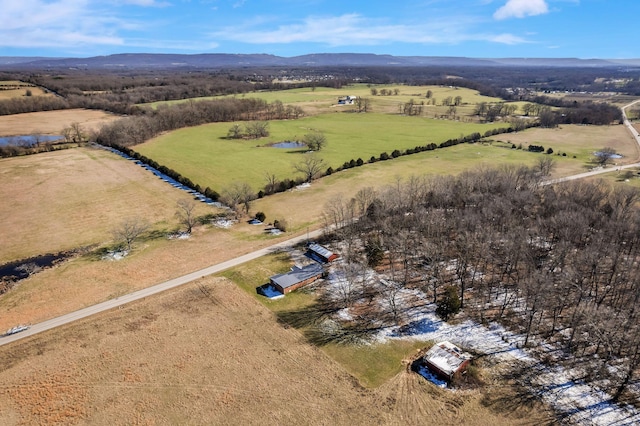 drone / aerial view with a mountain view and a rural view