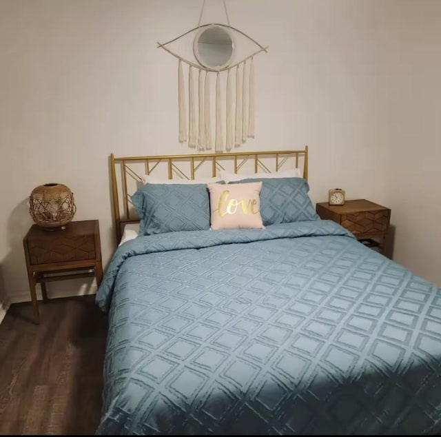 bedroom featuring wood finished floors