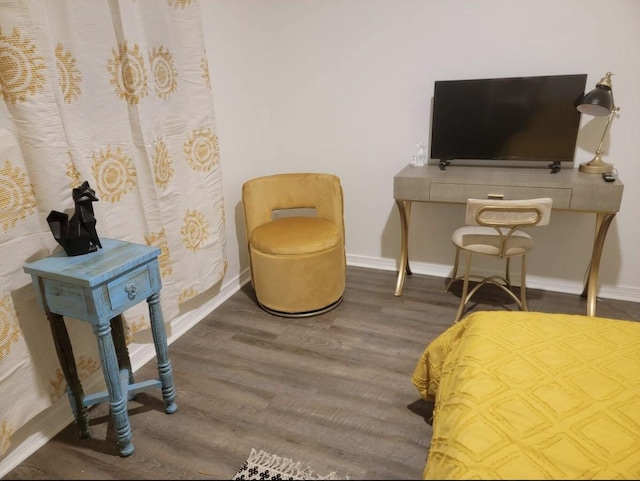 sitting room featuring wood finished floors and baseboards