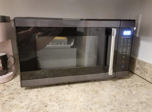 room details with stainless steel microwave