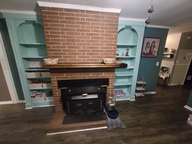 interior details featuring ornamental molding, a wood stove, built in shelves, and wood finished floors