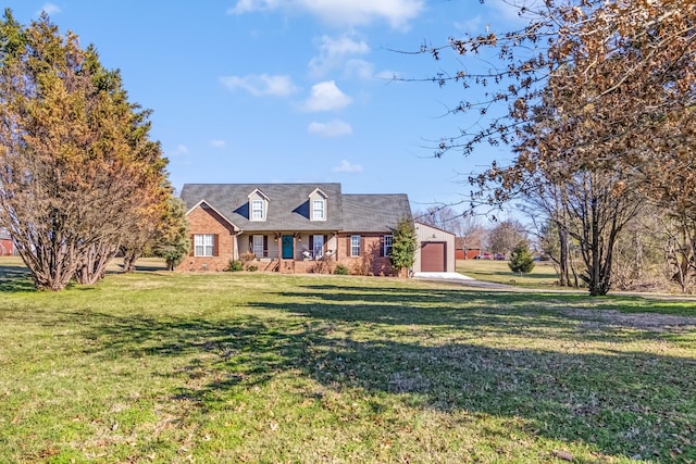 new england style home with a front lawn and brick siding