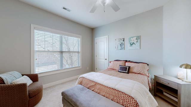 bedroom featuring light colored carpet, visible vents, ceiling fan, and baseboards