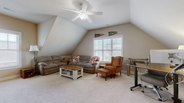 interior space with lofted ceiling, carpet floors, visible vents, and a wealth of natural light