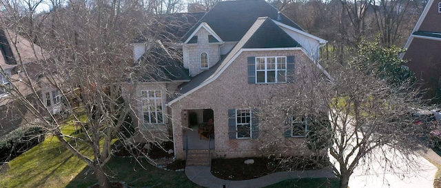 view of property exterior with brick siding