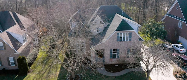 view of property exterior featuring a view of trees